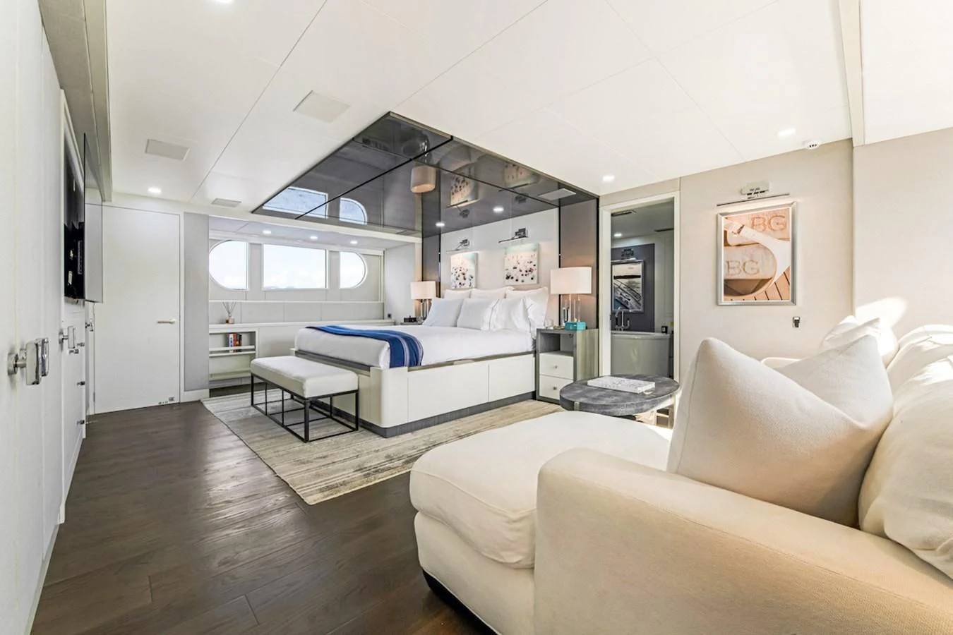 a living room with a large window aboard BG Yacht for Sale