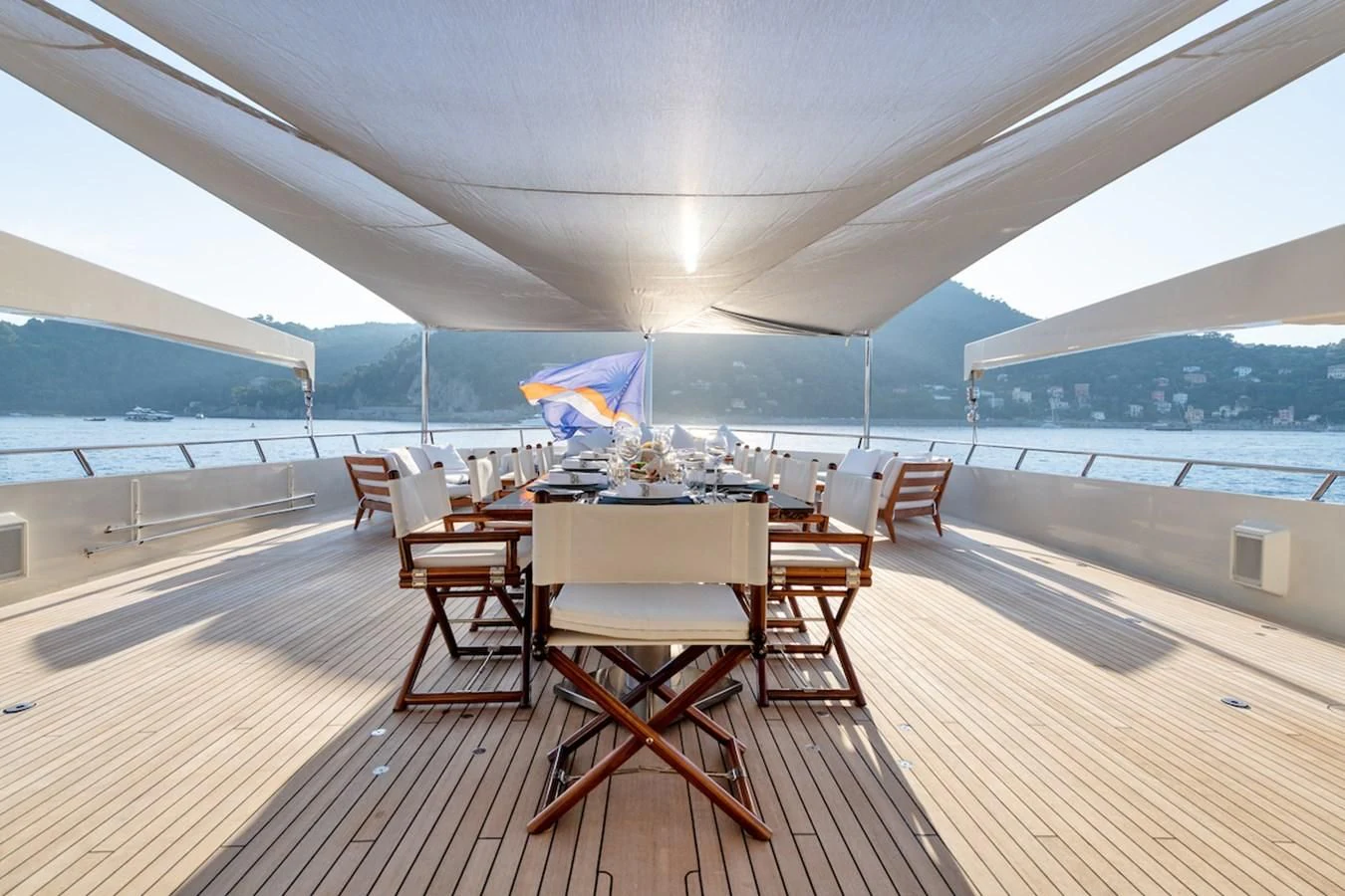 a room with a table and chairs aboard BG Yacht for Sale