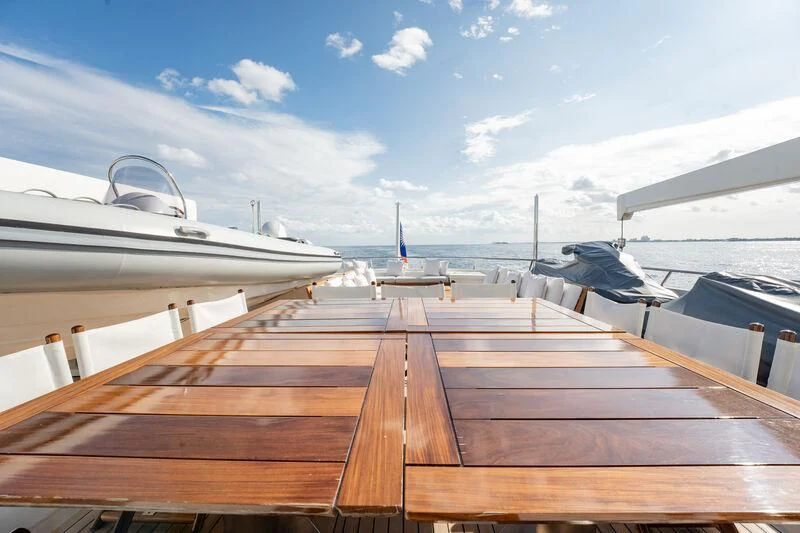a deck with a boat and a boat on it aboard BG Yacht for Sale