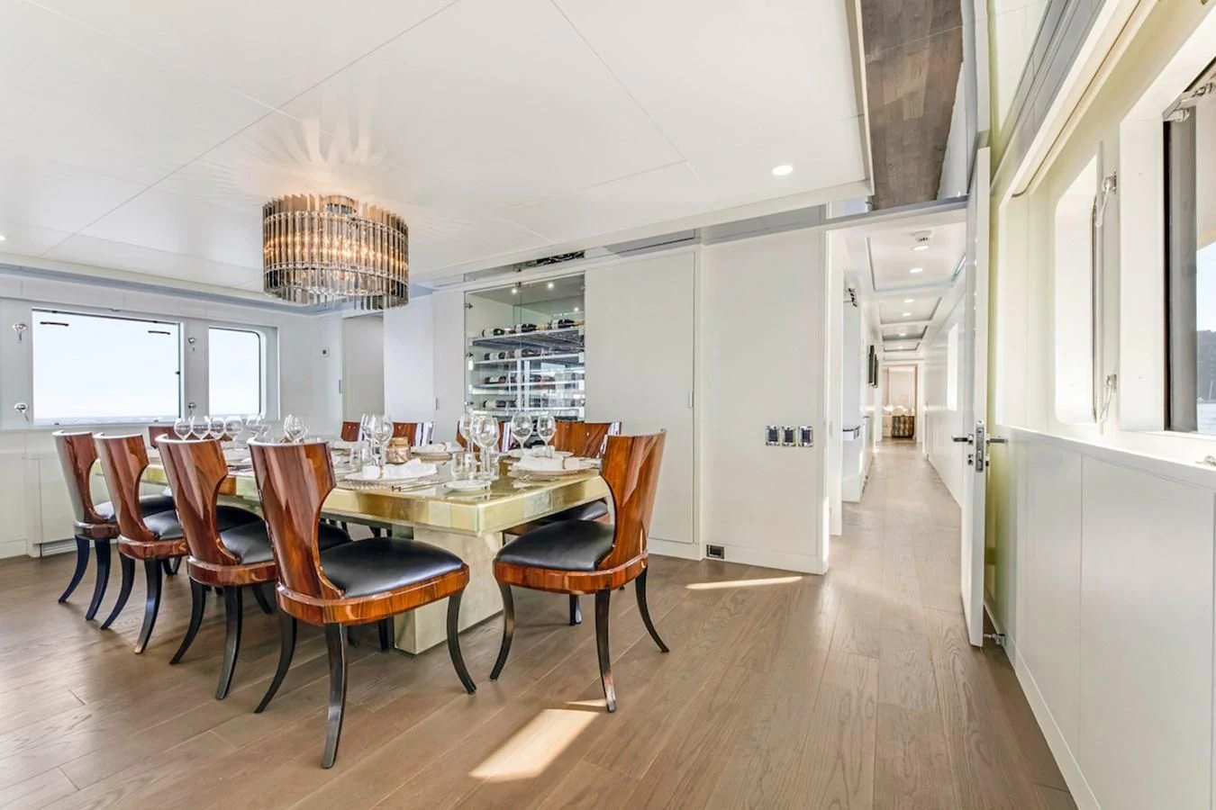 a dining room with a table and chairs aboard BG Yacht for Sale