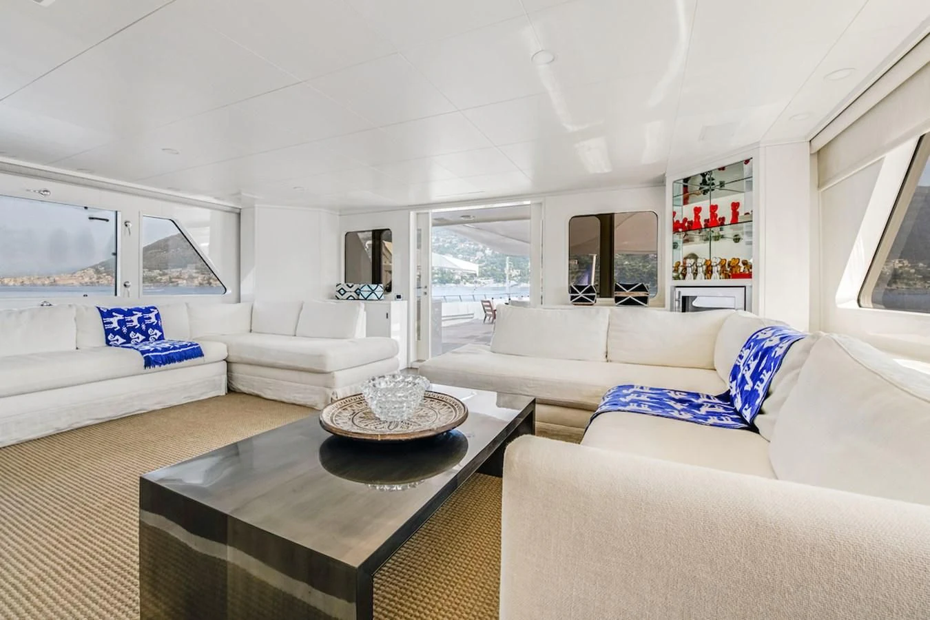 a living room with white couches aboard BG Yacht for Sale