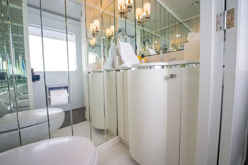 a bathroom with a glass shower aboard BG Yacht for Sale