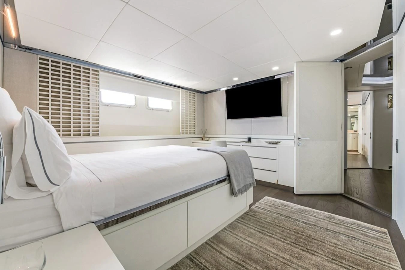 a room with a bed and a television aboard BG Yacht for Sale