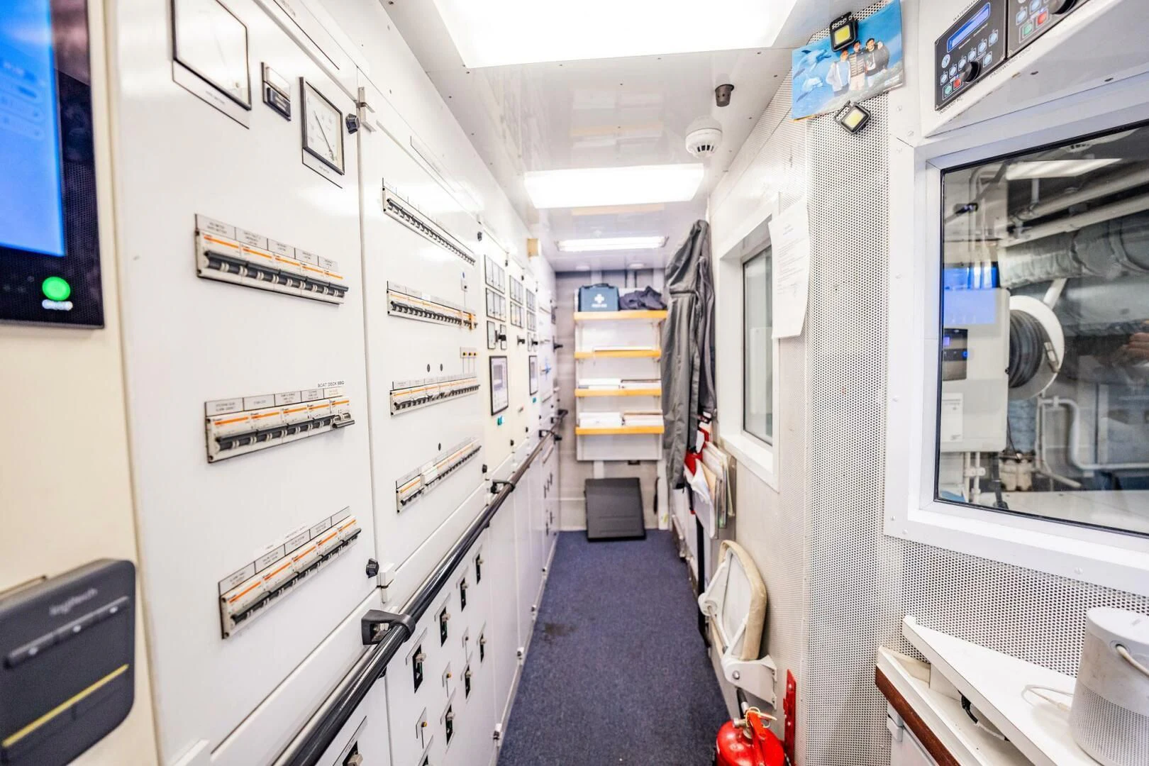 a hallway with several screens aboard BG Yacht for Sale