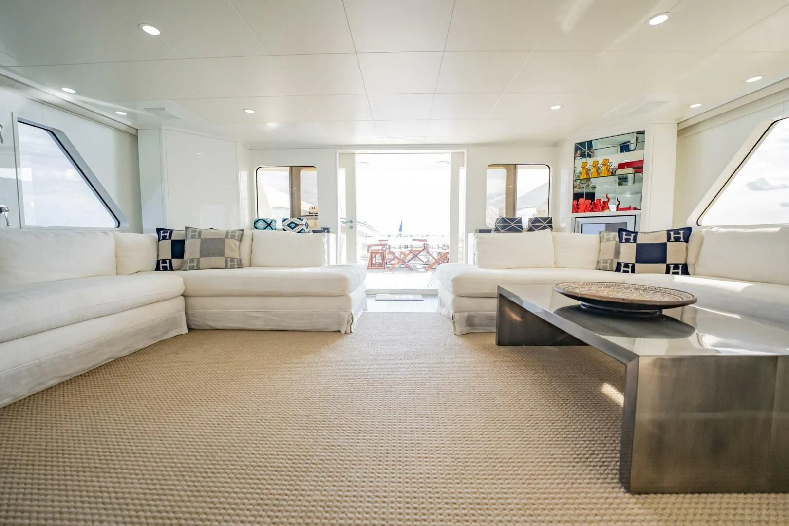 a living room with a large window aboard BG Yacht for Sale