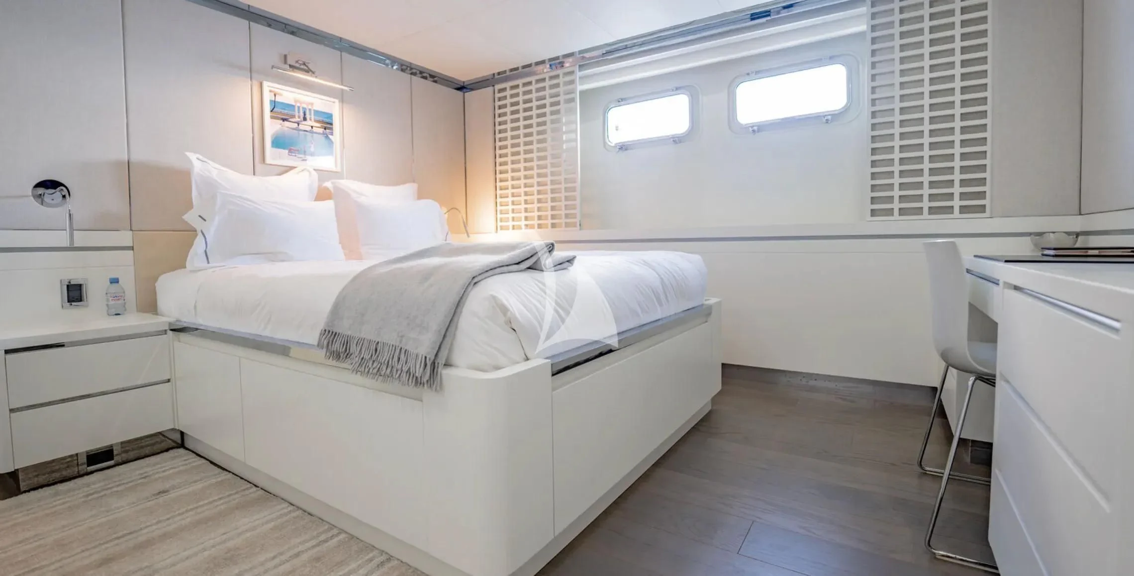 a room with a bed and a desk aboard BG Yacht for Sale