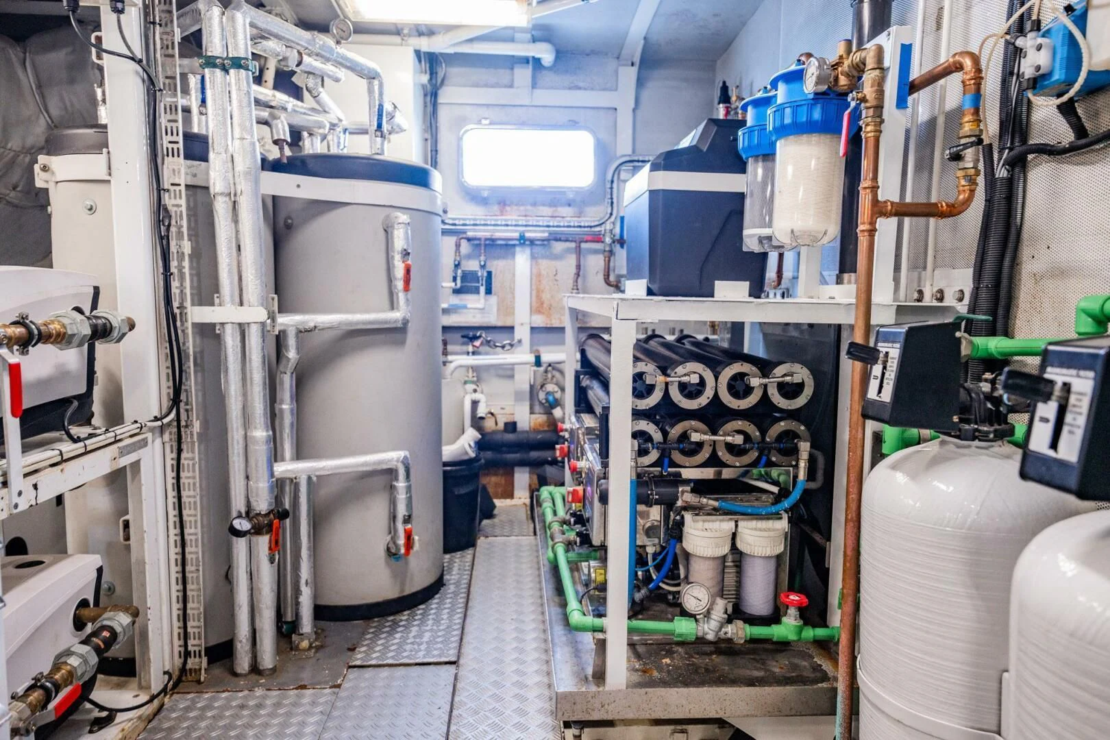 a room with pipes and equipment aboard BG Yacht for Sale