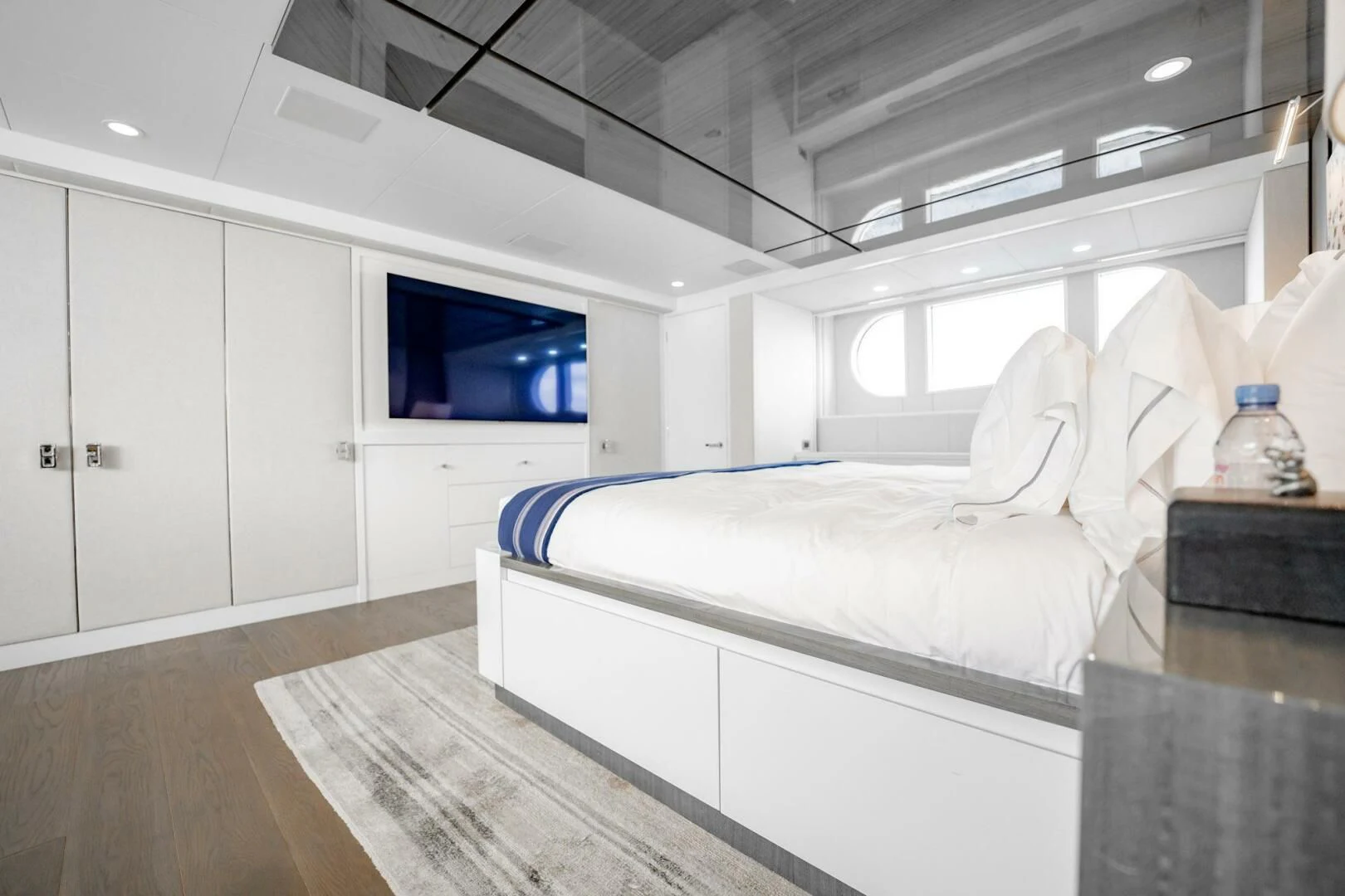 a white bed in a room aboard BG Yacht for Sale