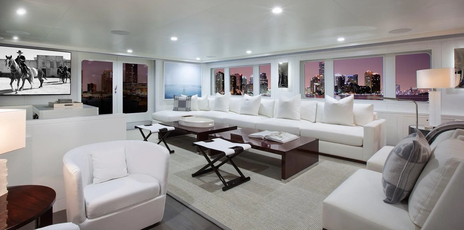 a living room with white furniture aboard BG Yacht for Sale