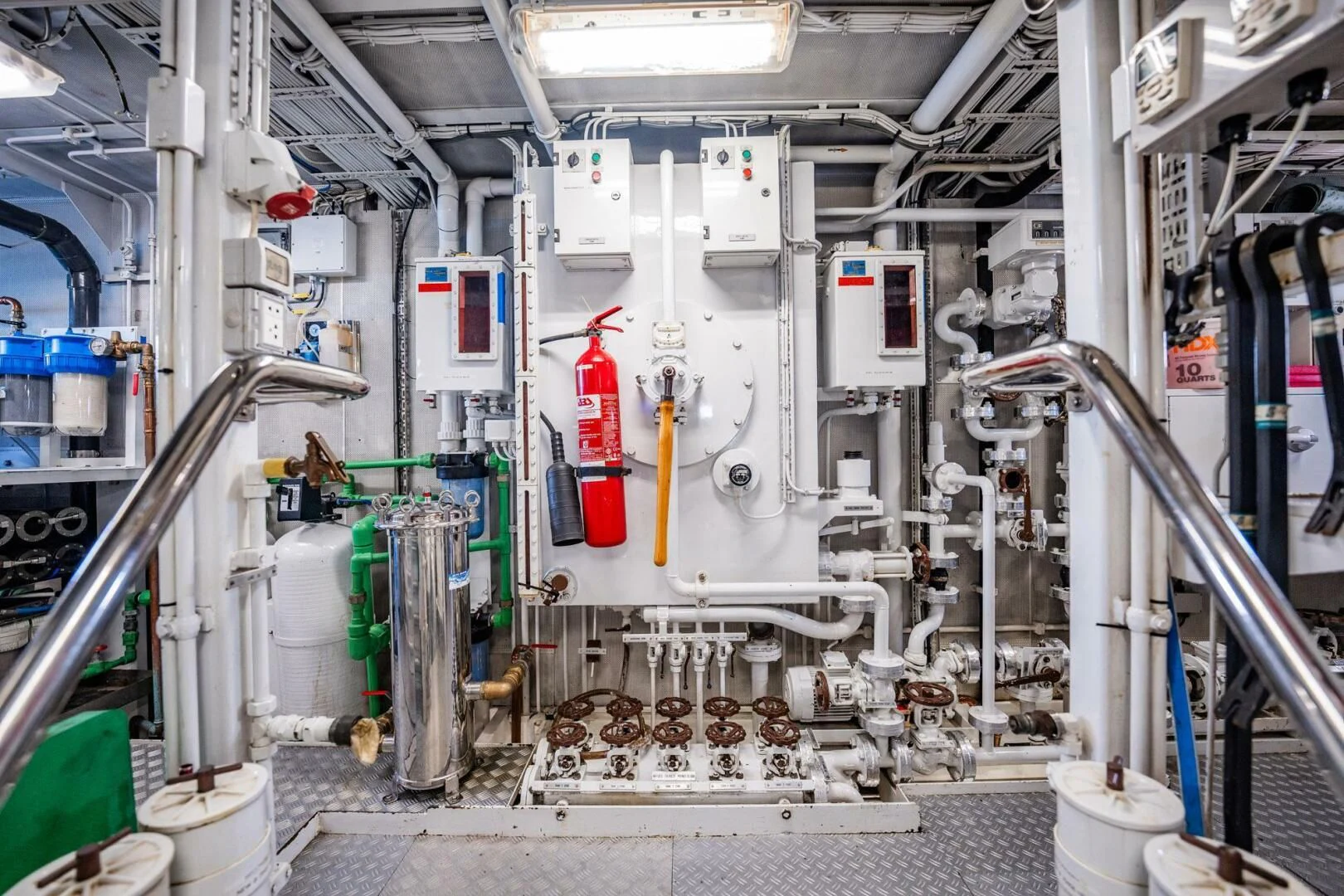 a room with pipes and machinery aboard BG Yacht for Sale