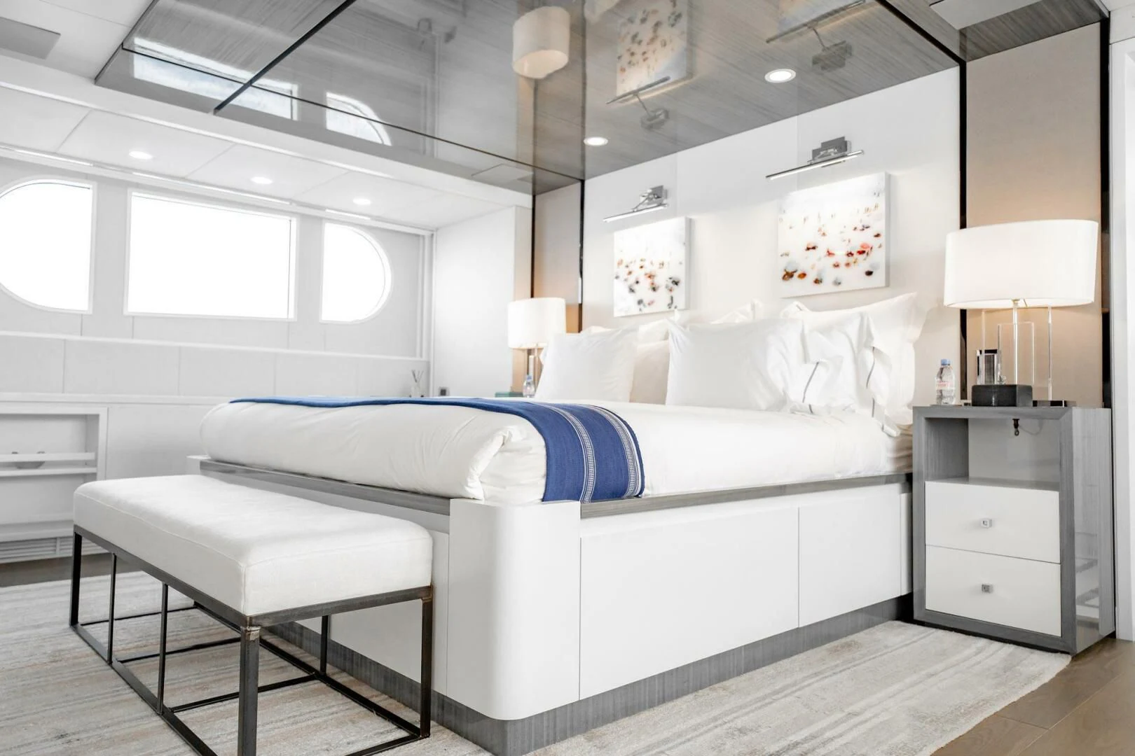 a bedroom with a bed and a desk aboard BG Yacht for Sale