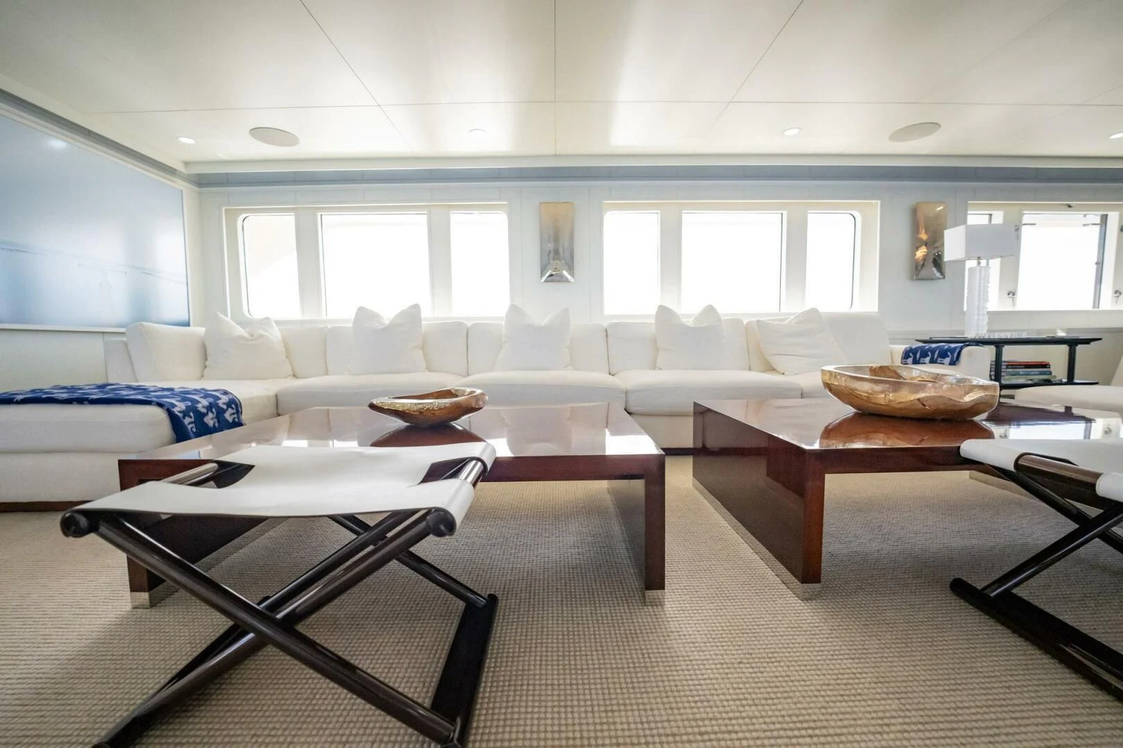 a living room with white furniture aboard BG Yacht for Sale