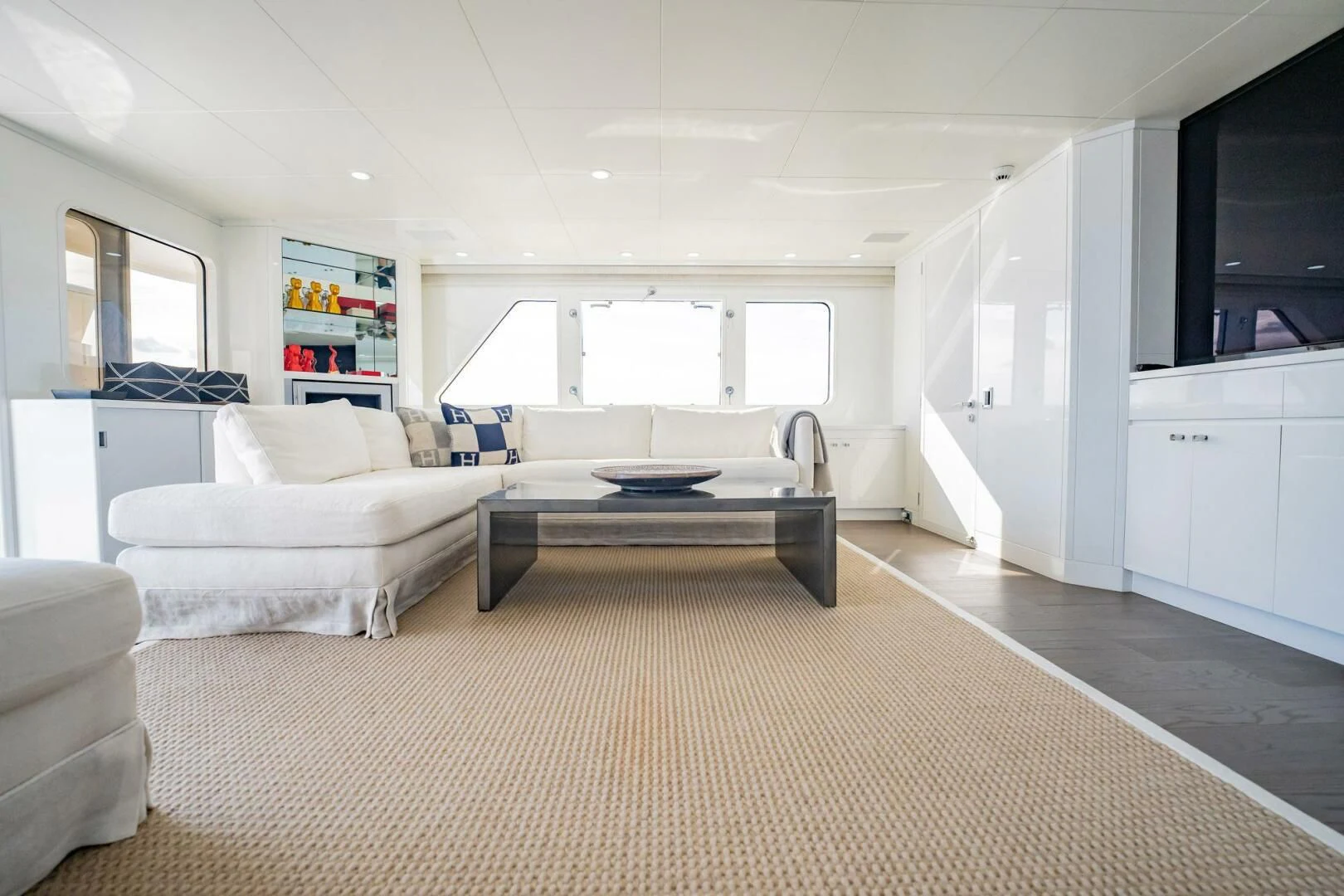 a living room with a couch and a table aboard BG Yacht for Sale
