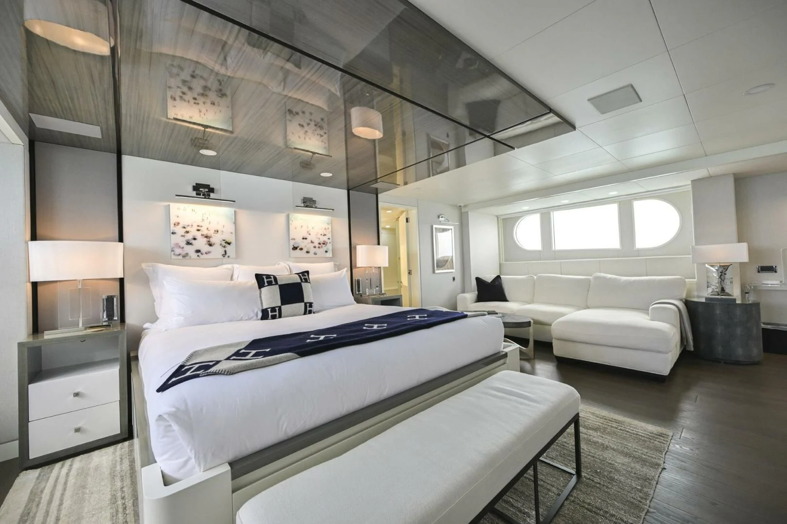 a room with a bed and a couch aboard BG Yacht for Sale