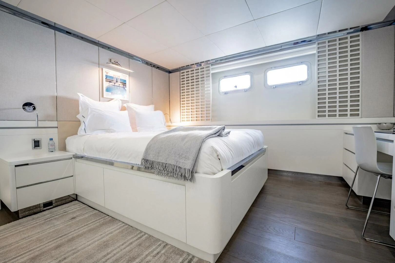 a room with a bed and a desk aboard BG Yacht for Sale