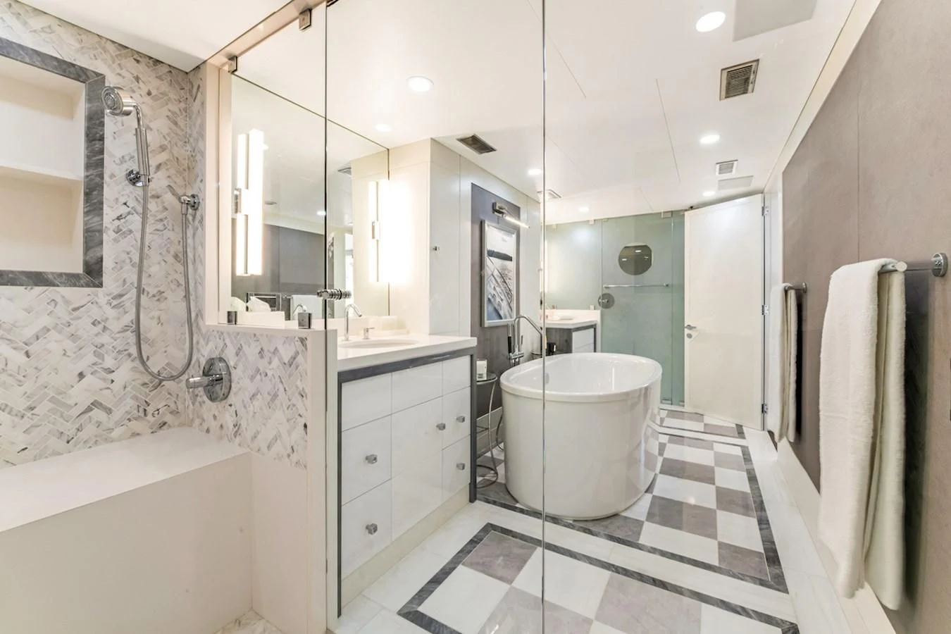 a bathroom with a tub sink and a mirror aboard BG Yacht for Sale