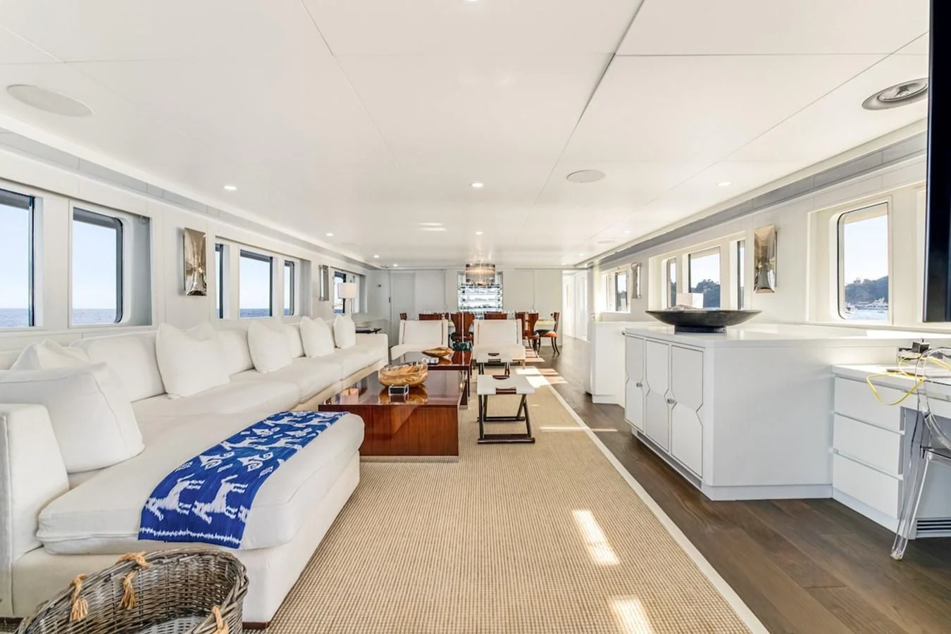 a living room with a couch and a table aboard BG Yacht for Sale
