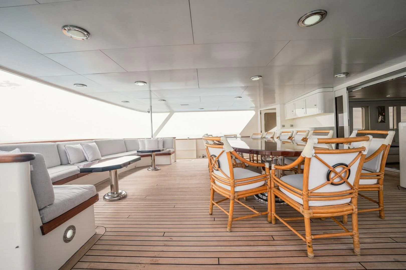 a room with a couch and a table and chairs aboard BG Yacht for Sale