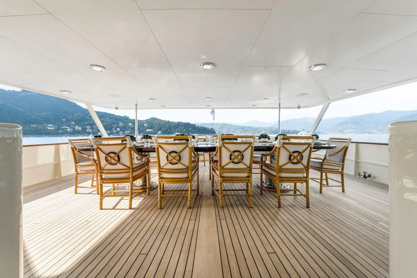 a group of chairs on a deck aboard BG Yacht for Sale