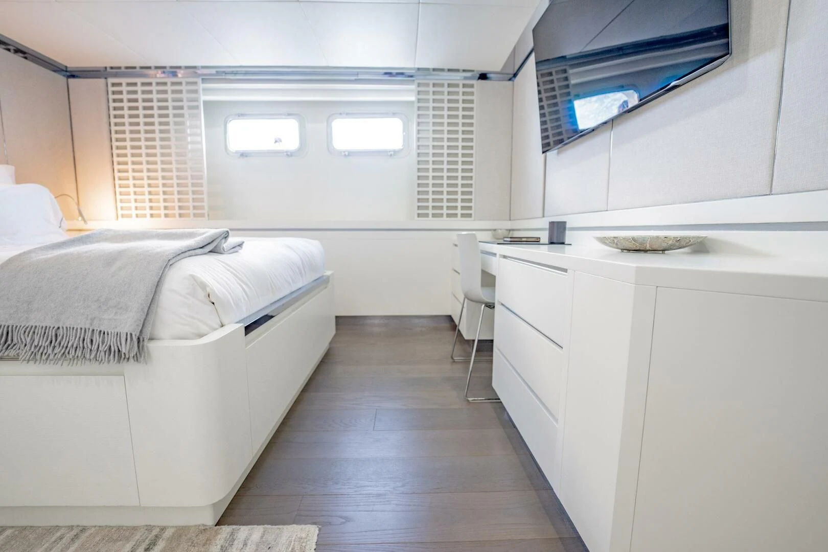 a room with a bed and a tv aboard BG Yacht for Sale