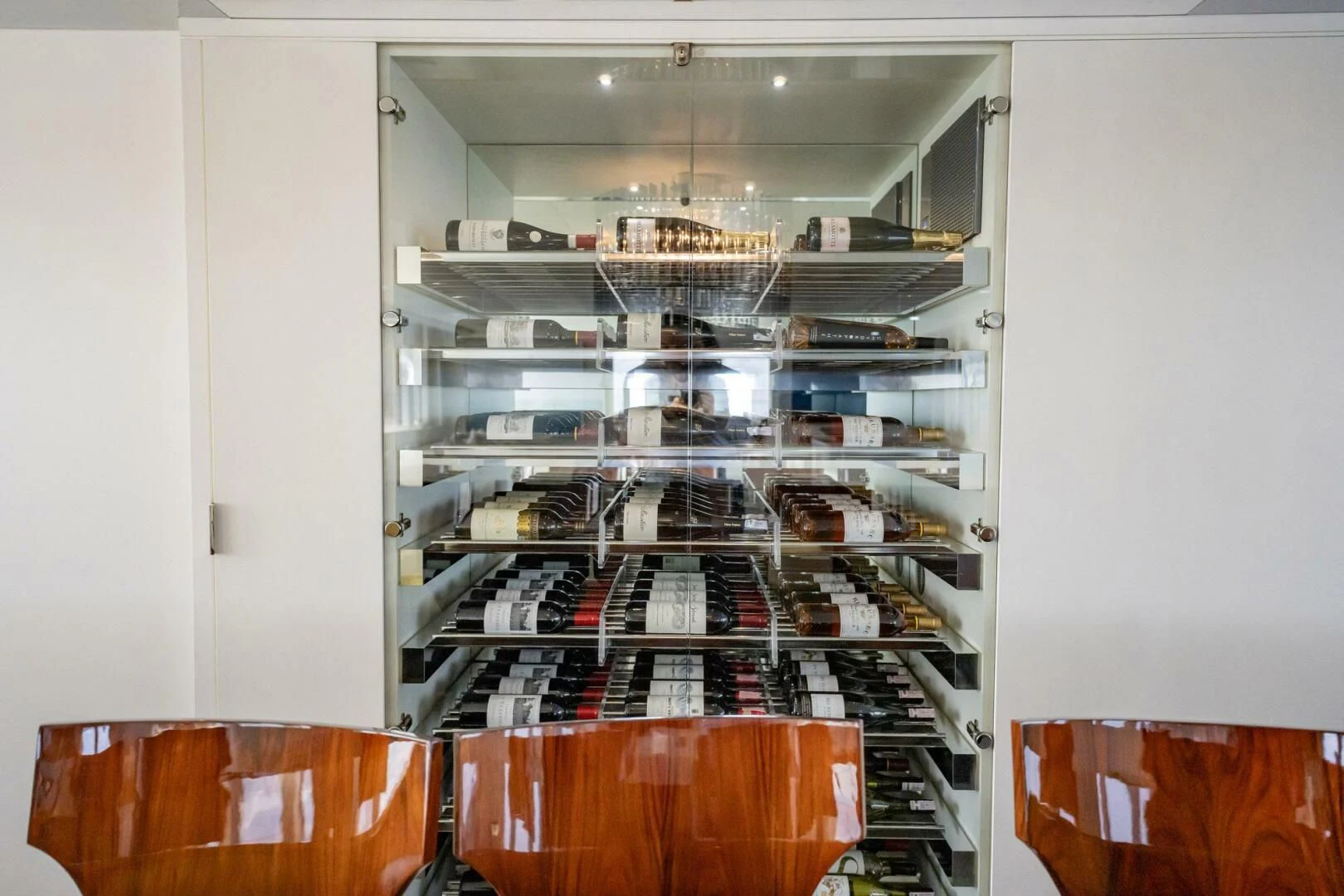 a large kitchen with a lot of shelves and a white wall aboard BG Yacht for Sale