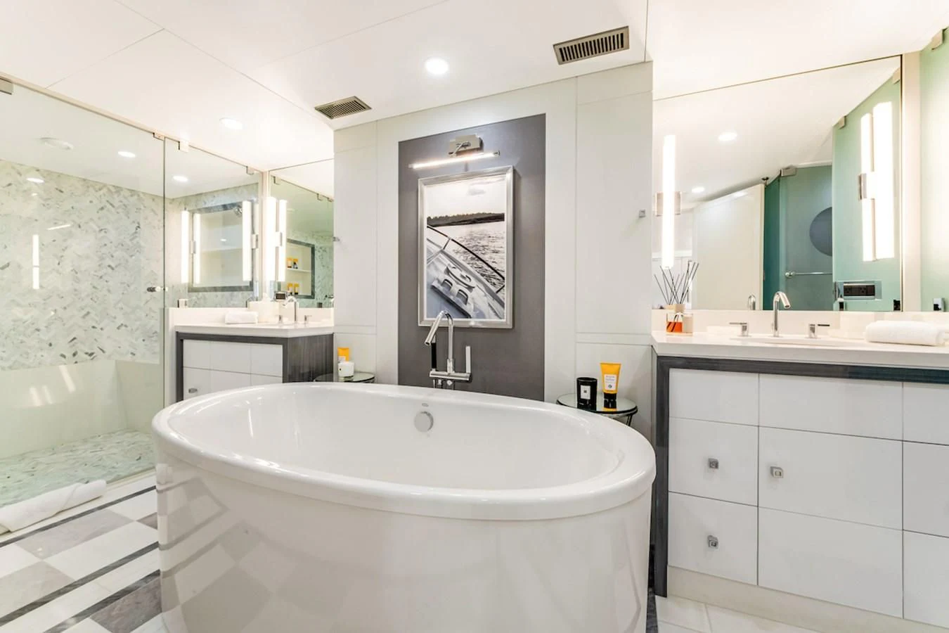 a bathroom with a tub sink and mirror aboard BG Yacht for Sale