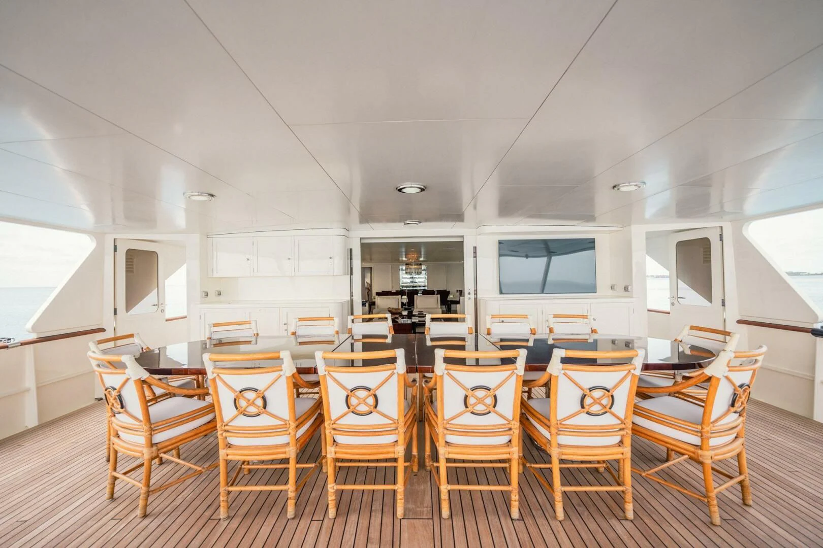 a room with chairs and a table aboard BG Yacht for Sale