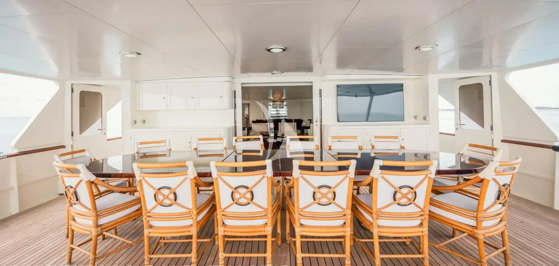 a room with chairs and a tv aboard BG Yacht for Sale