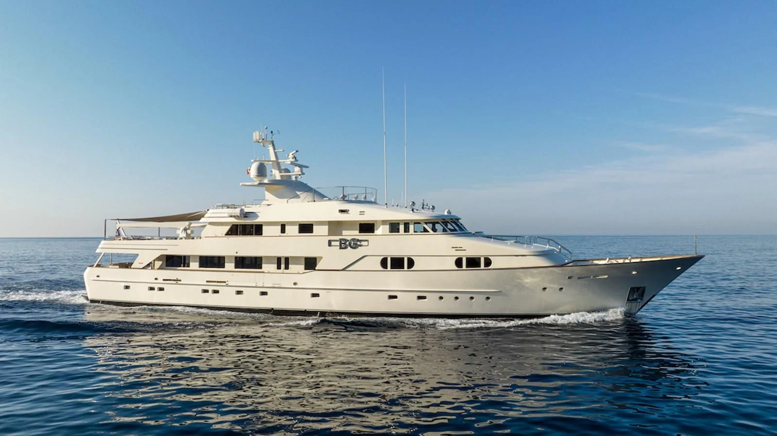 a large white boat in the water aboard BG Yacht for Sale