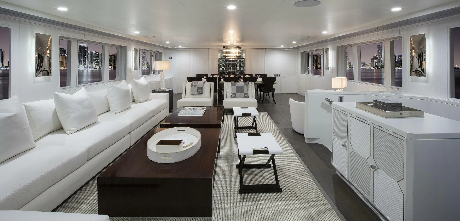a large living room with a white couch and a table aboard BG Yacht for Sale