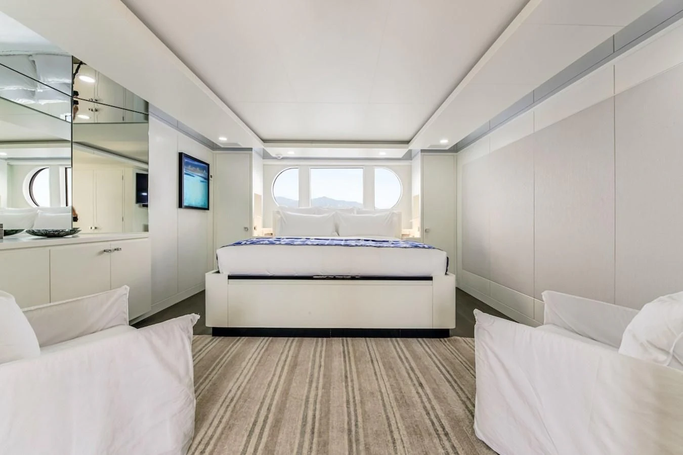 a room with a bed and a window aboard BG Yacht for Sale