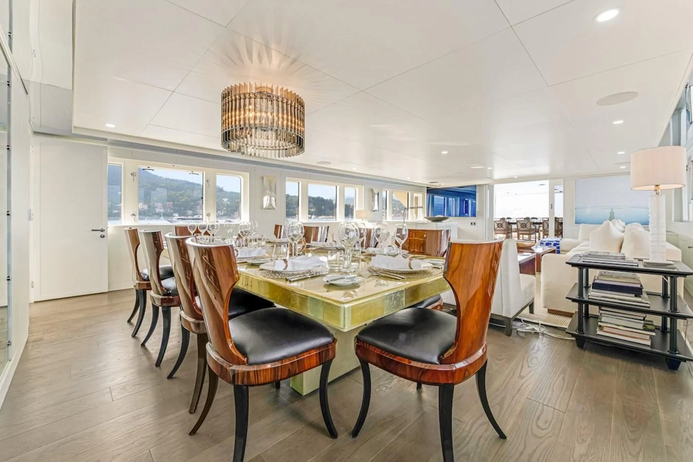 a dining room with a table and chairs aboard BG Yacht for Sale