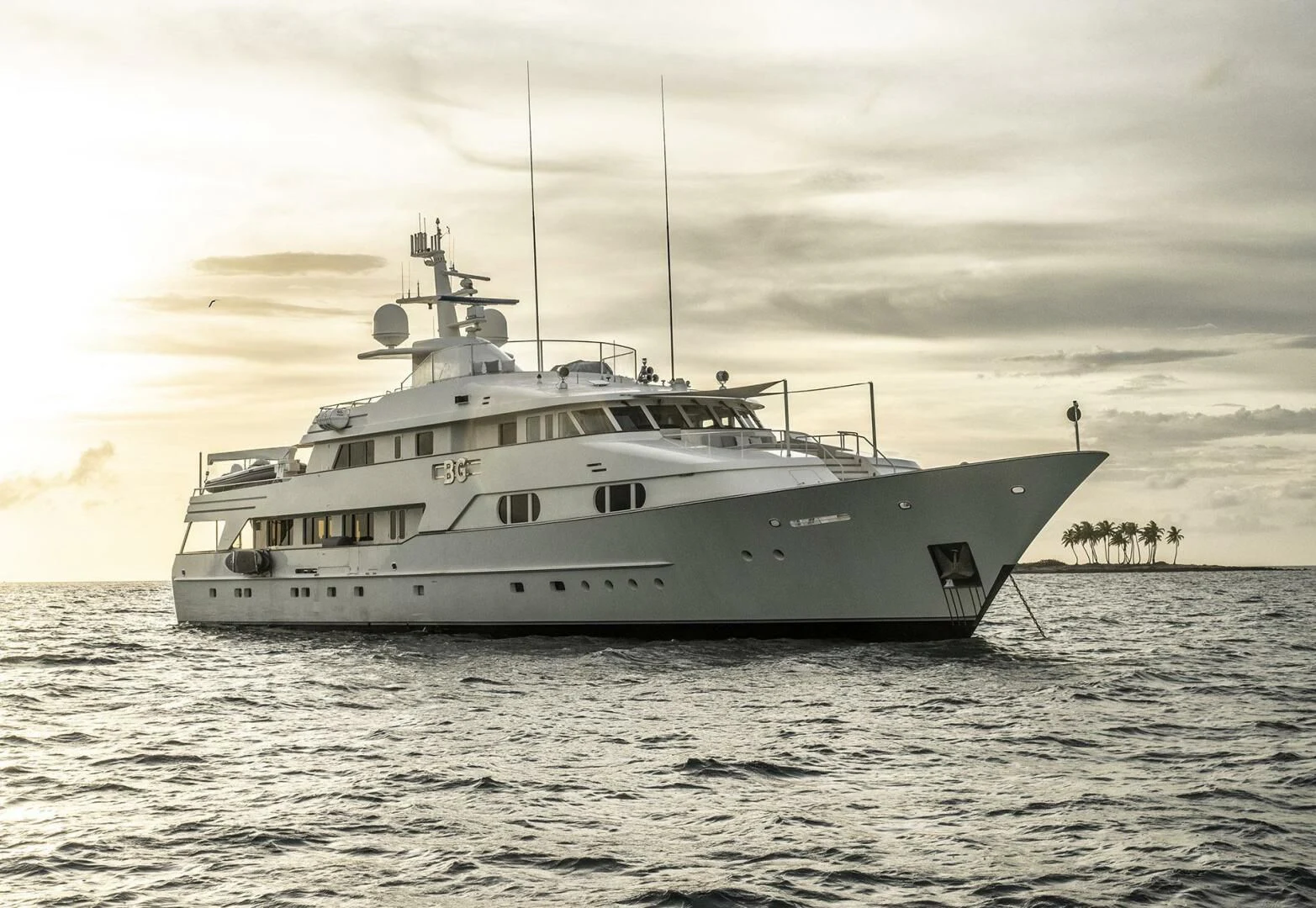 a white boat in the water aboard BG Yacht for Sale