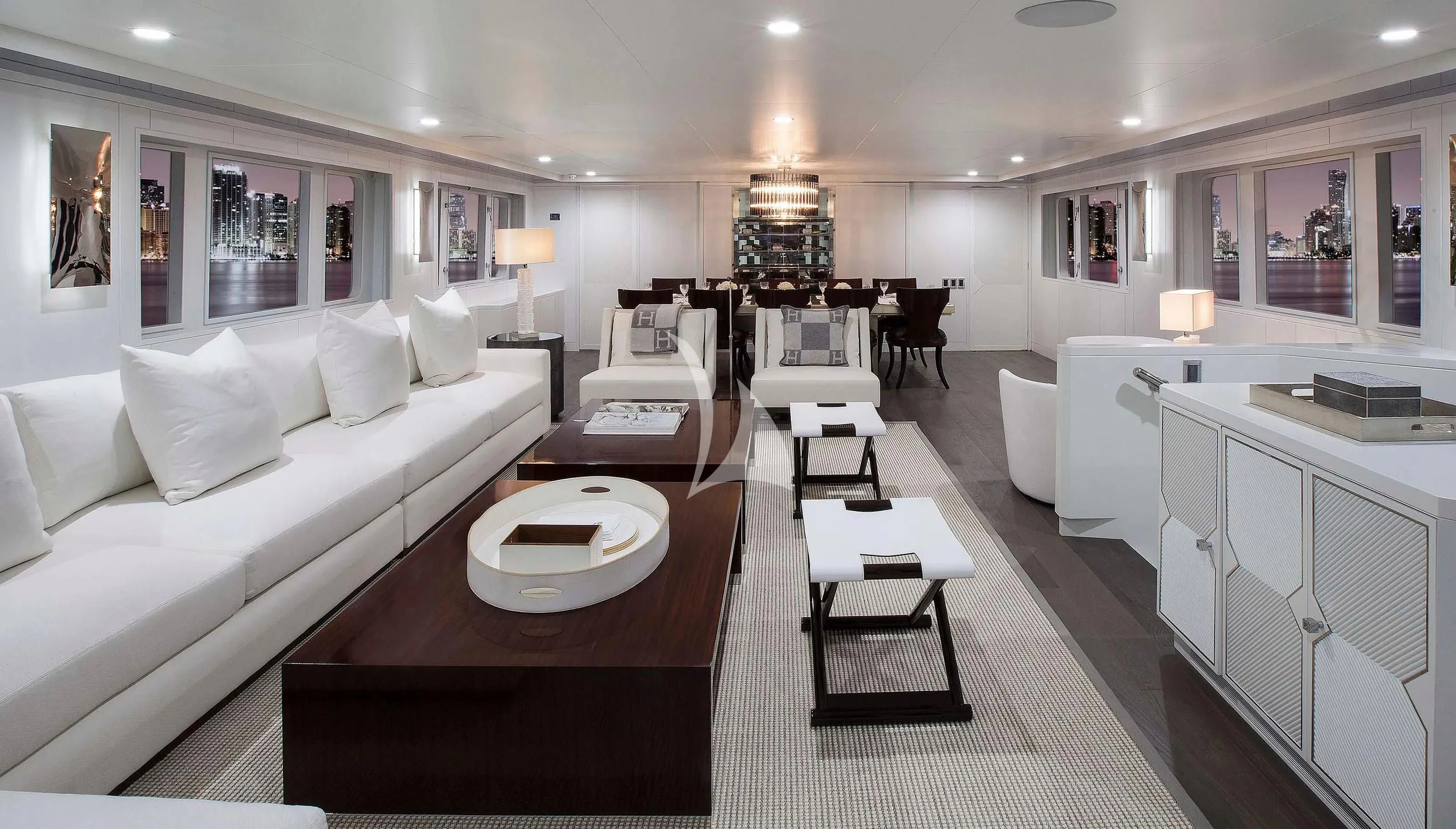 a living room with a white couch and a table aboard BG Yacht for Sale