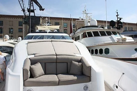 a group of white cars parked in a parking lot aboard STREGA Yacht for Sale