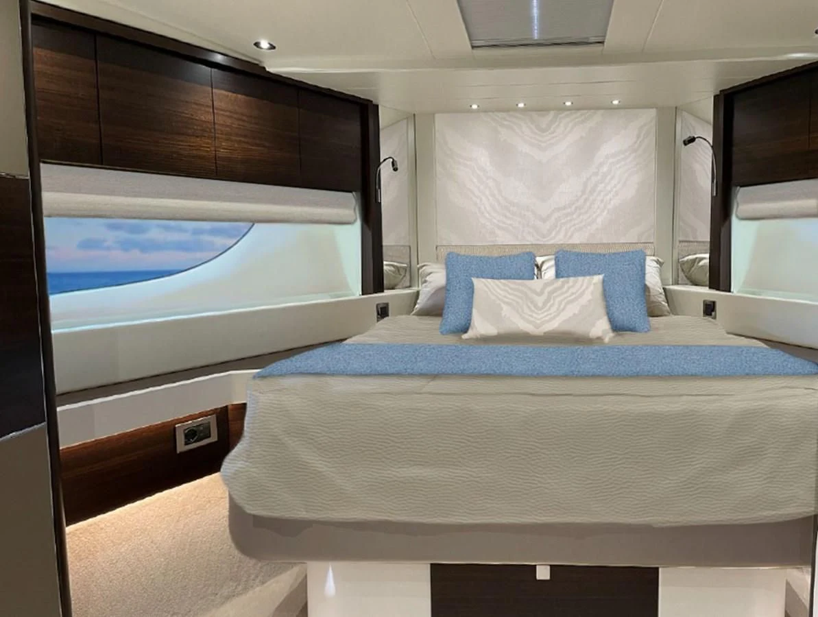 a bed with a blue sheet aboard CHINONINO Yacht for Sale