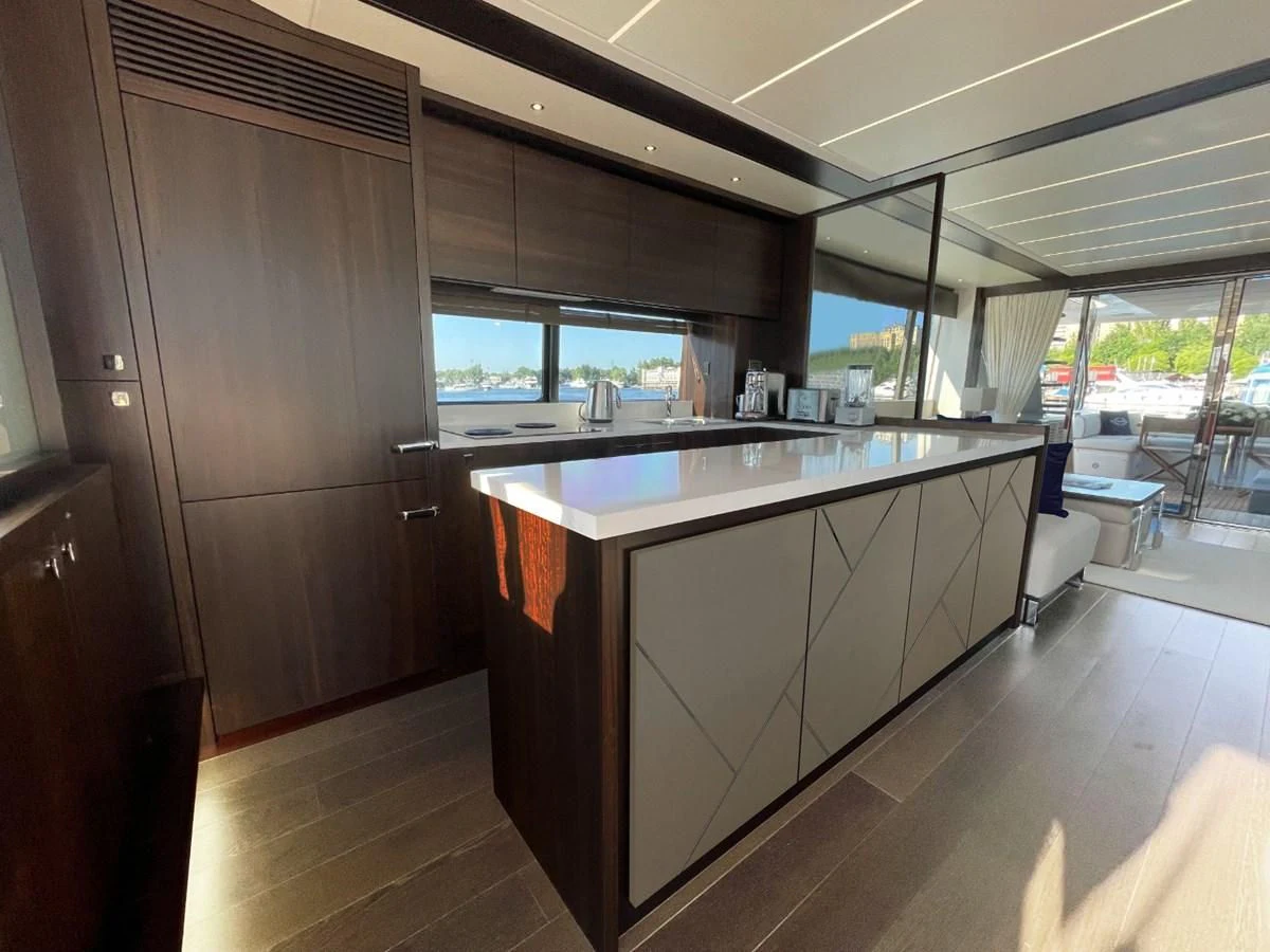 a kitchen with a large island aboard CHINONINO Yacht for Sale