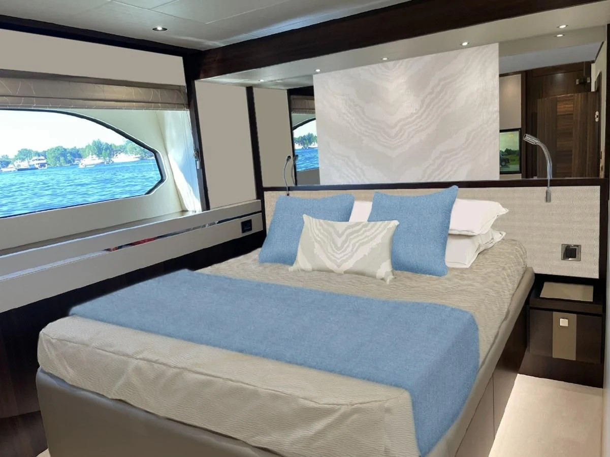 a bed with a blue pillow aboard CHINONINO Yacht for Sale