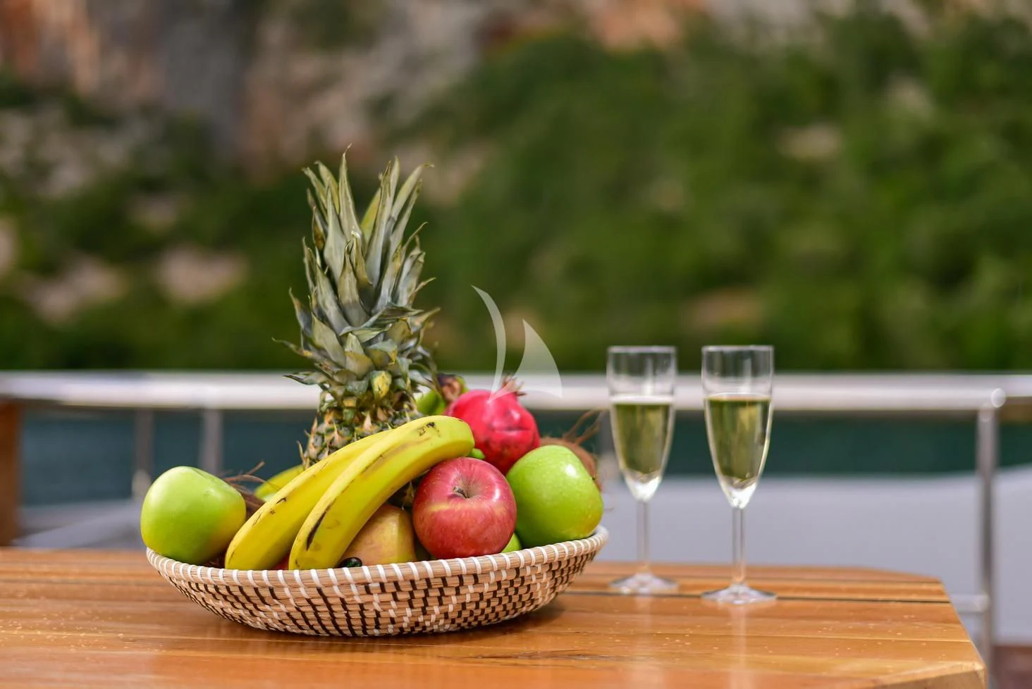 a basket of fruits and wine aboard STELA 117 Yacht for Sale