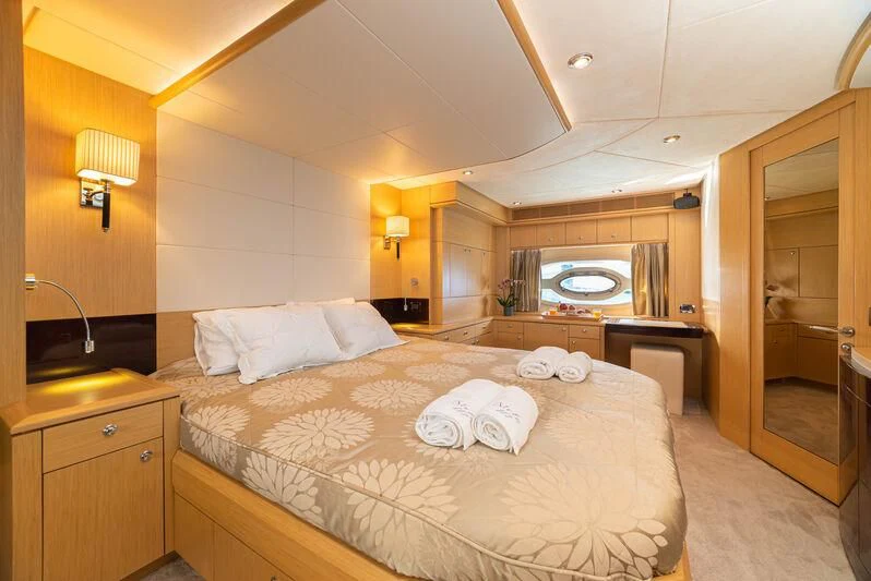 a large bed in a hotel room aboard STELA 117 Yacht for Sale