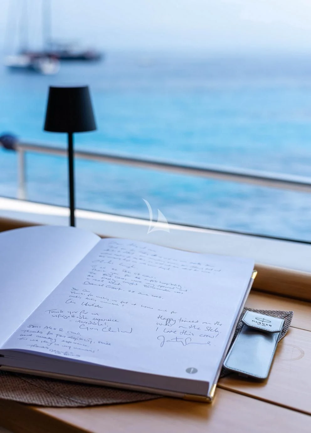 a book on a table aboard STELA 117 Yacht for Sale
