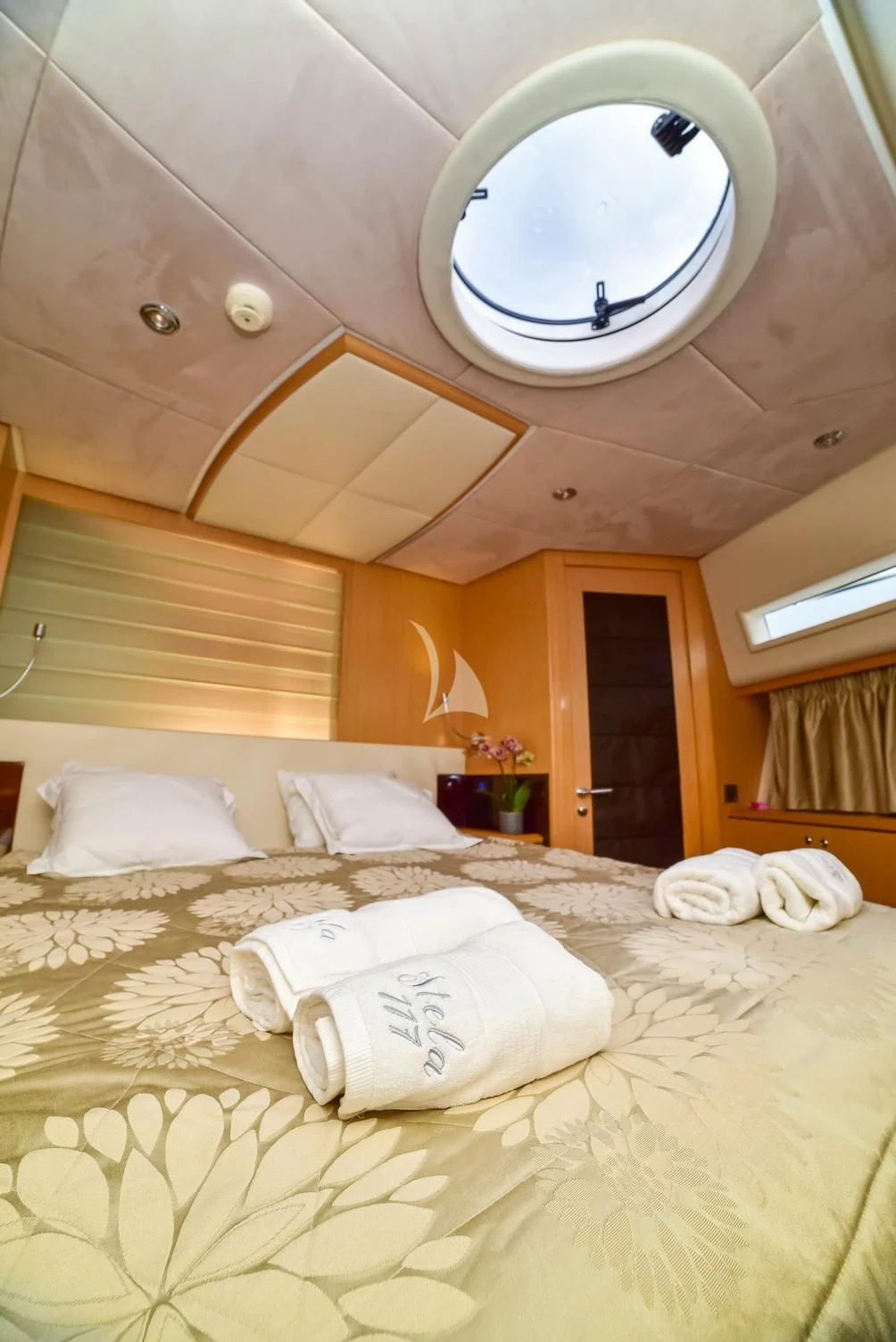 a bed with white pillows aboard STELA 117 Yacht for Sale