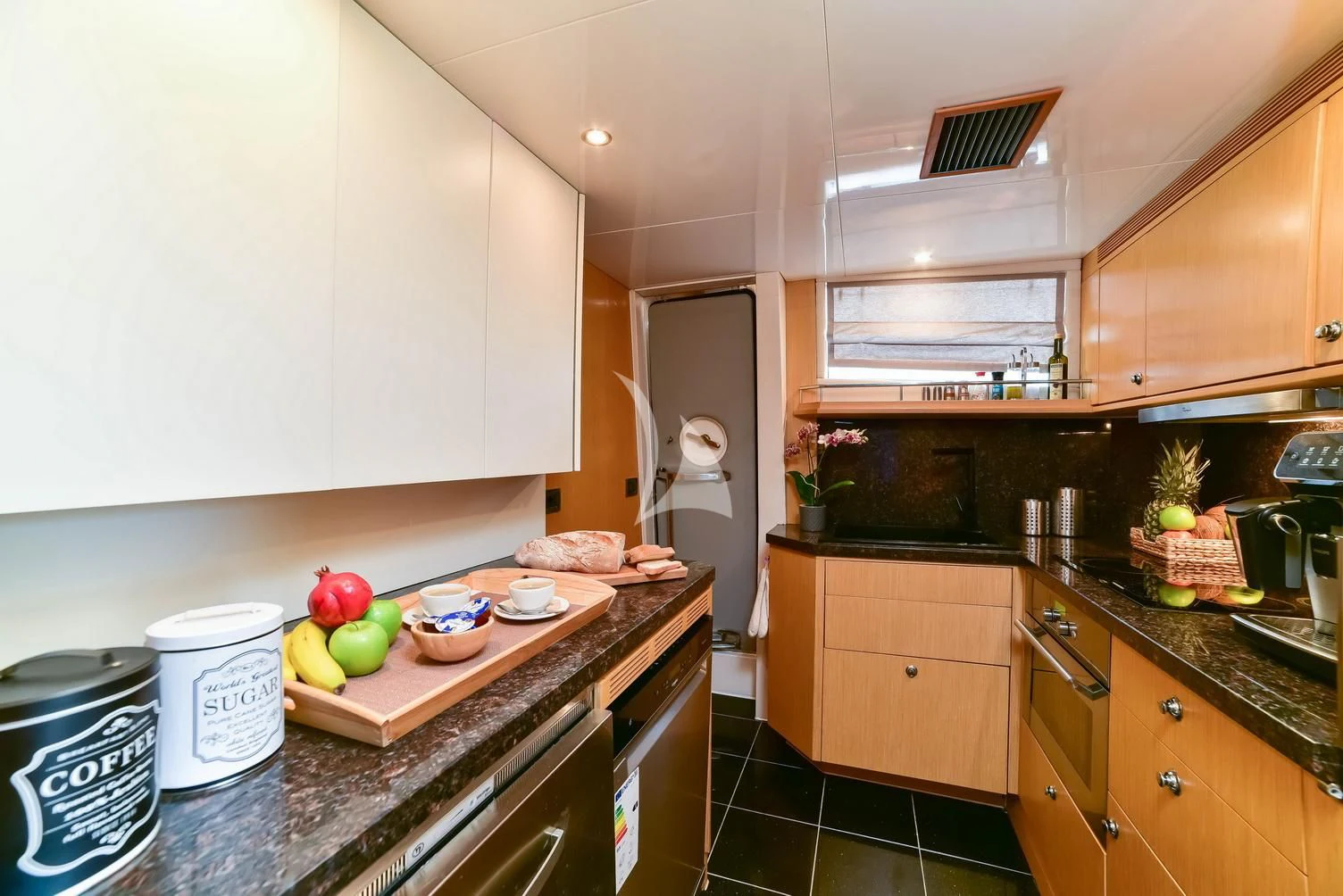 a kitchen with a countertop and a sink aboard STELA 117 Yacht for Sale