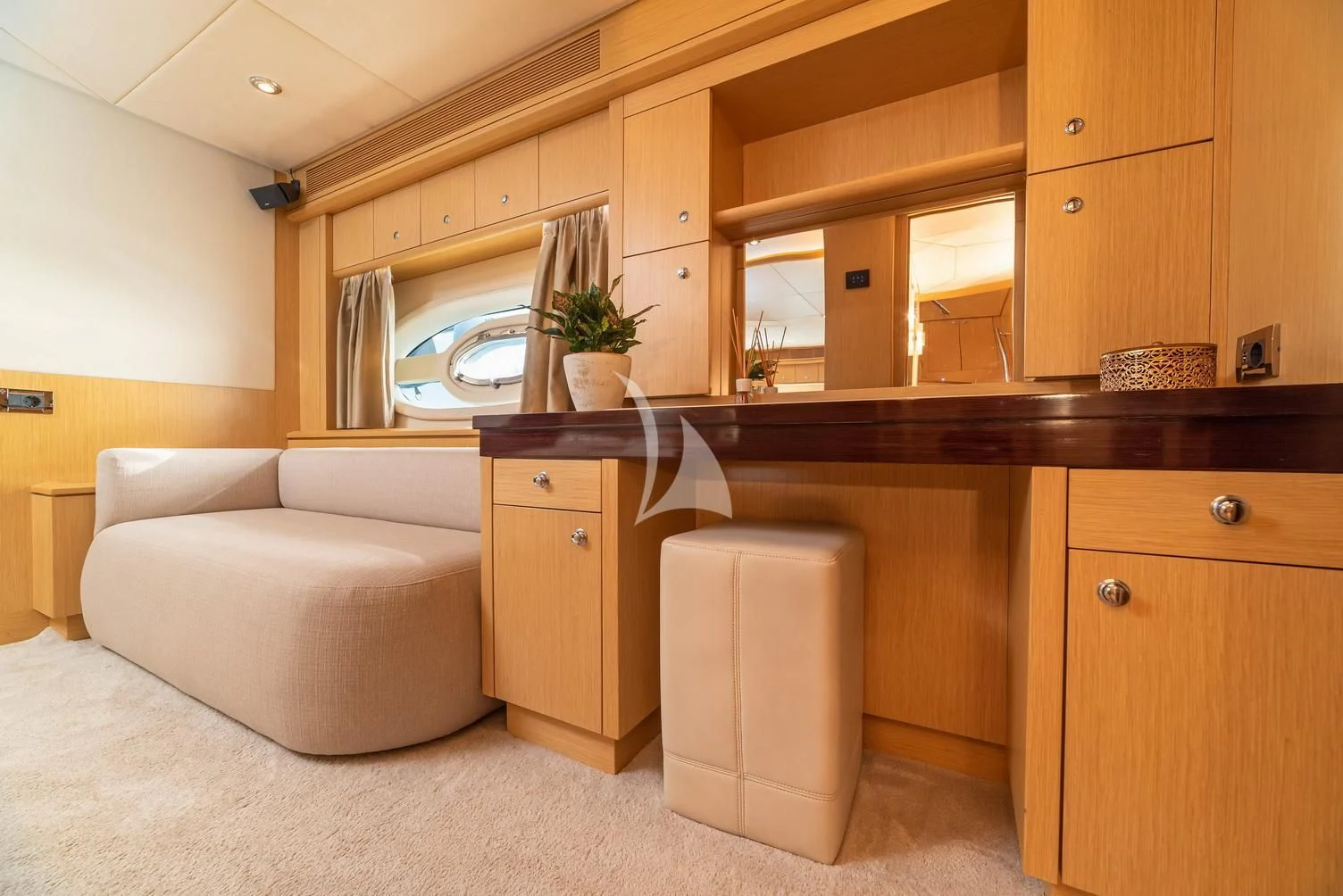 a kitchen with wooden cabinets aboard STELA 117 Yacht for Sale