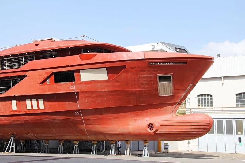 a large red boat aboard AMO Yacht for Sale