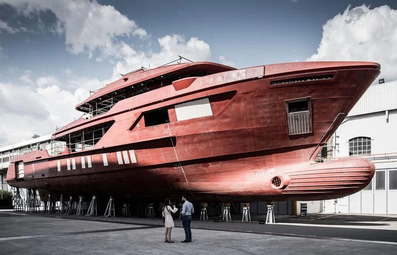a large red boat aboard AMO Yacht for Sale