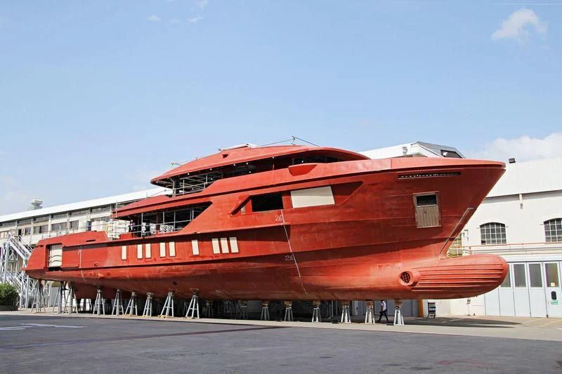 a large red boat aboard AMO Yacht for Sale
