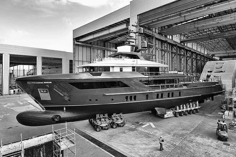 a large airplane parked in a hangar aboard AMO Yacht for Sale
