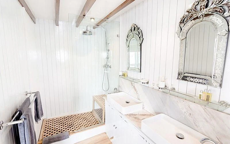 a bathroom with a sink and a mirror aboard MISCHIEF Yacht for Sale