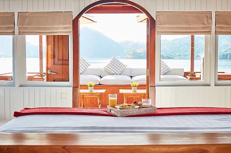 a room with a window and a table with a window aboard MISCHIEF Yacht for Sale